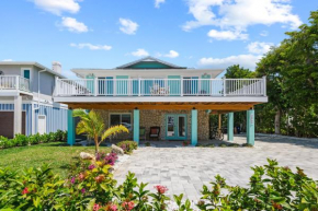 Go to the beach from expansive heated pool home